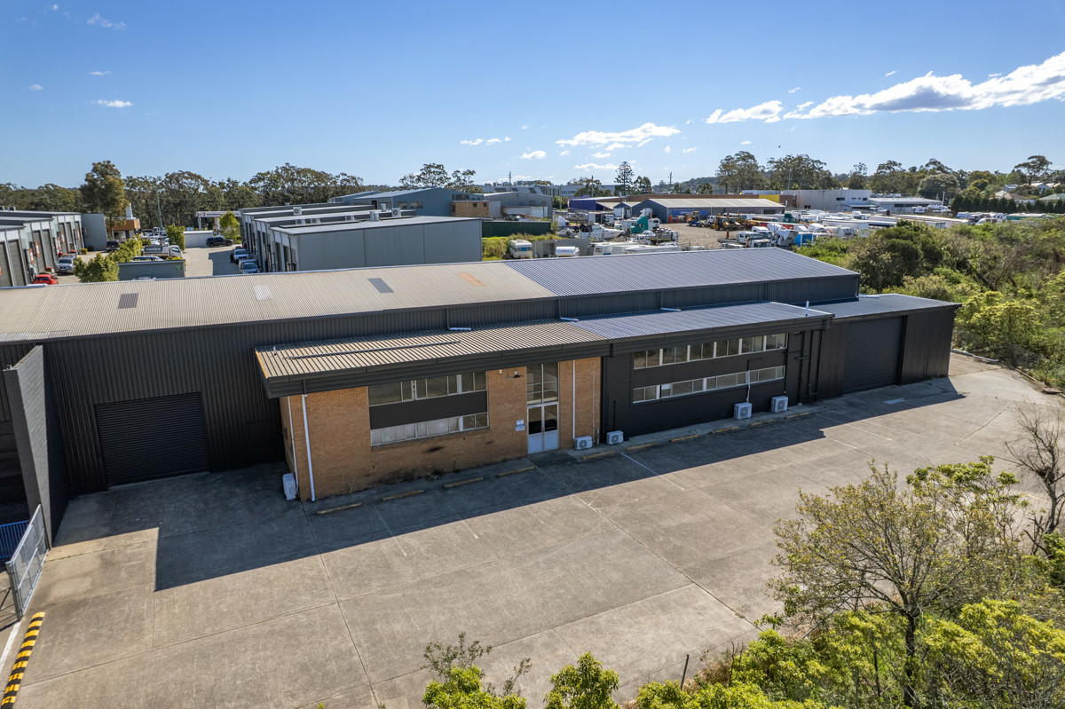 Industrial warehouse with crane and hardstand