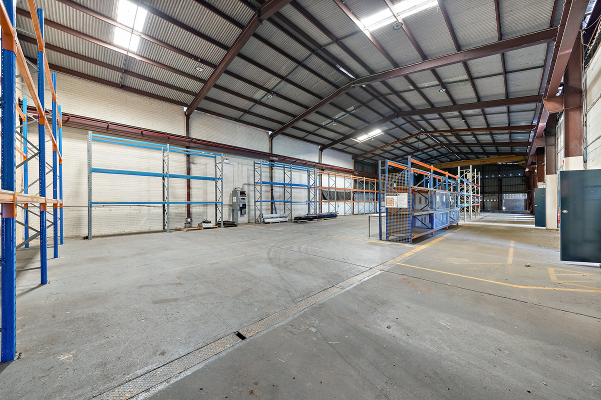 Industrial warehouse with crane and hardstand
