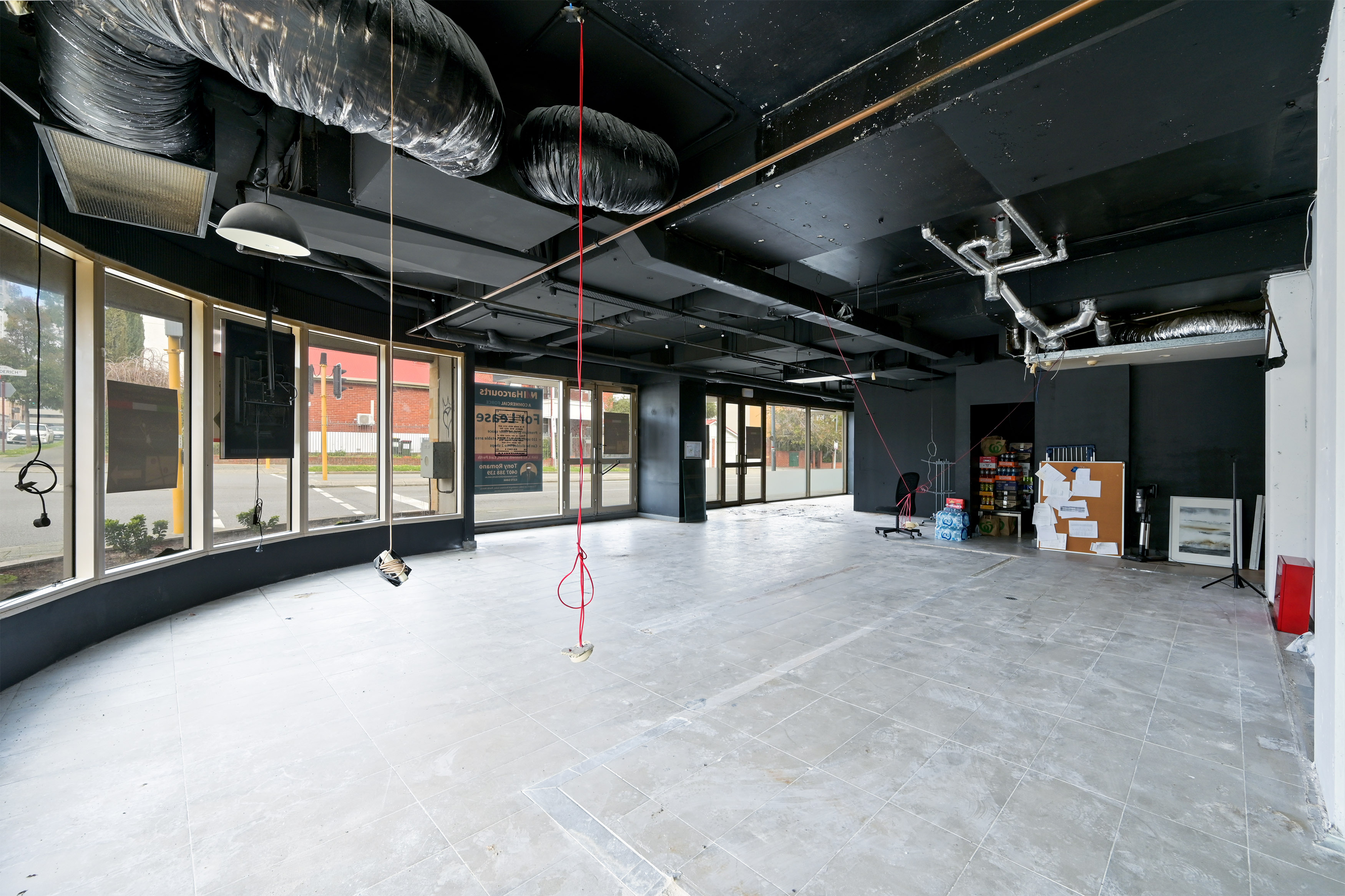 Prominent Corner Tenancy with Extensive Street Frontage