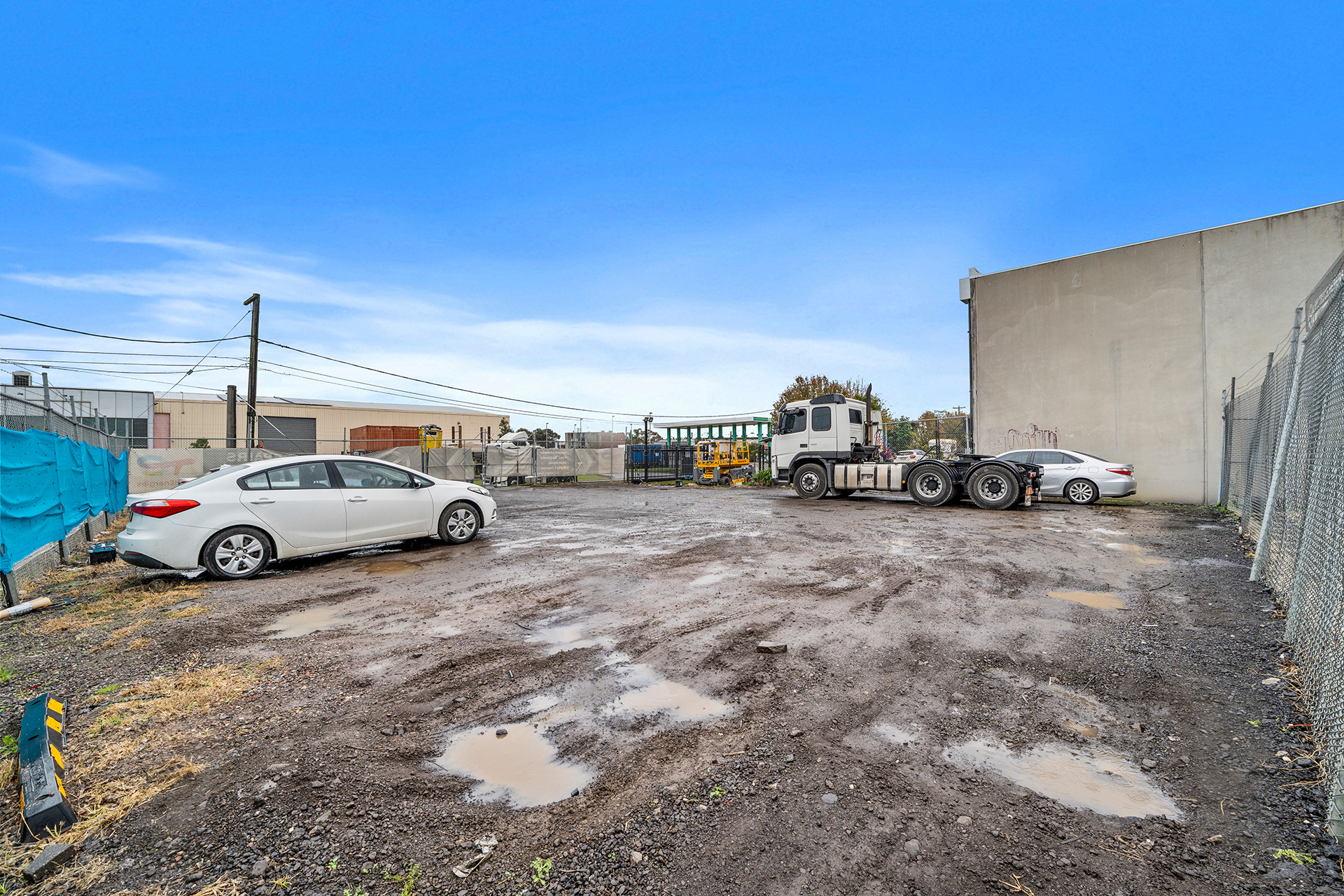 PROMINENT CORNER WITH OFFICE, YARD AND FREEWAY ACCESS.
