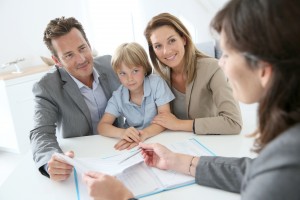 Family meeting real-estate agent to buy new home