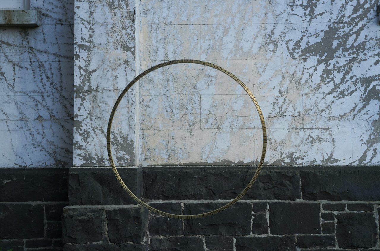 New Day Sculpture.  Katheryn Leopoldseder Brass and patina. 900x20mm.  Photography: Fred Kroh, Rear wall Sacred Heart.