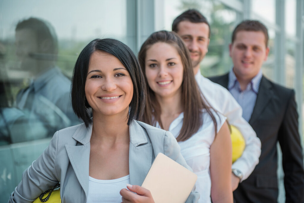 A group of smiling students stand together confidently, celebrating their fast-tracked qualification pathways through RPL.