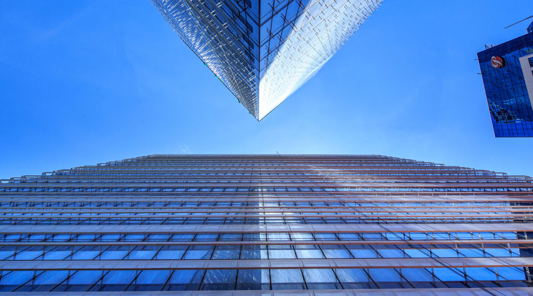 The gills on the south and west-facing walls of Net Lima let slivers on sunlight inside while still shielding the interiors from view.