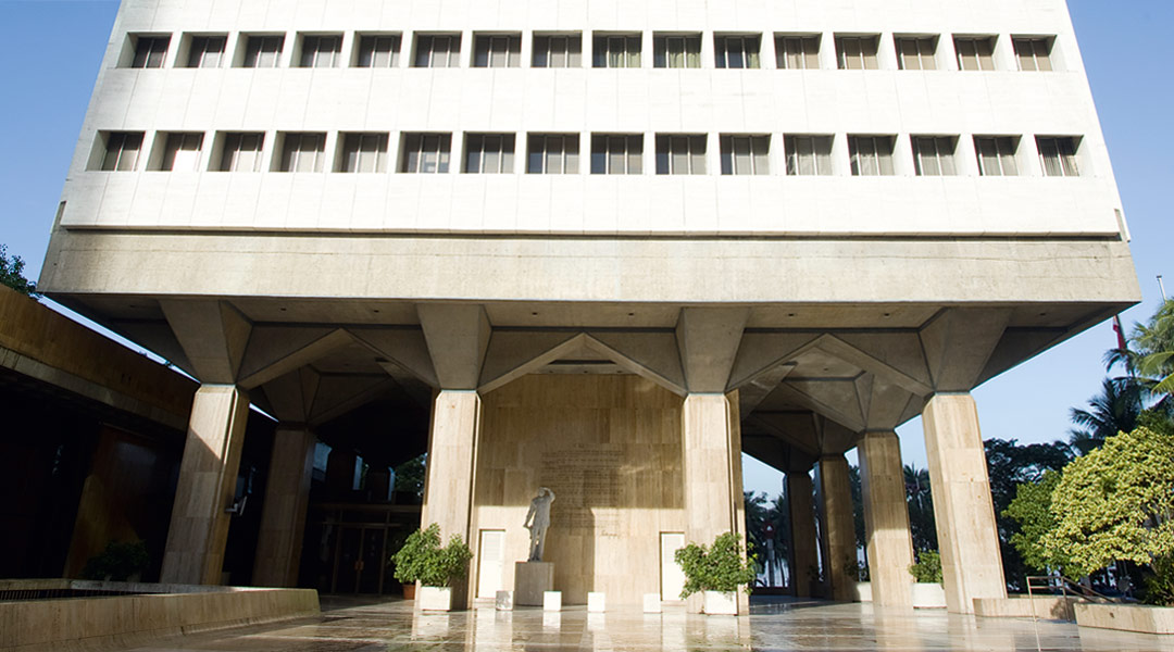 The Ramon Magsaysay Center paving reflects the tower’s massive pillars, doubling their height and seeming to carry the building even higher.