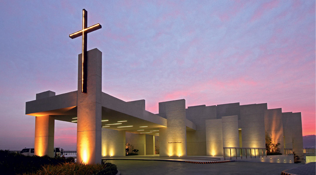 Dusk at Cebu City’s new ecclesiastical landmark by CAZA—a chapel with a non-traditional silhouette, sitting on a reclamation site that is now a beehive of construction activity in the South’s premiere metropolis.