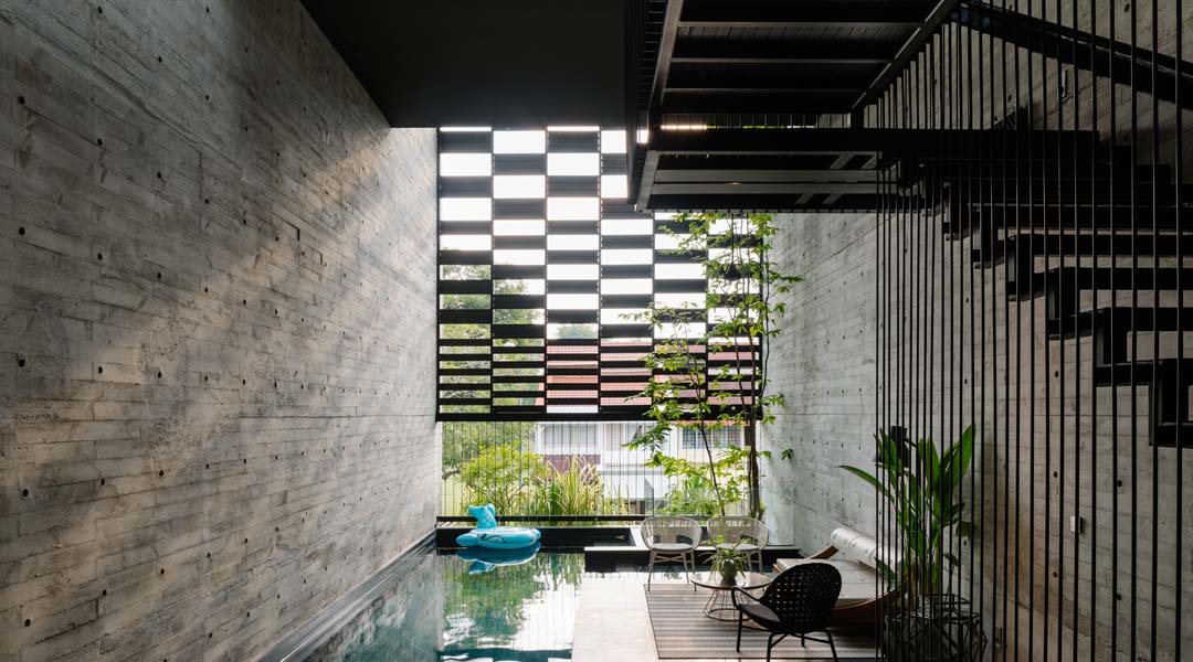 View of the Open House second-floor pool from outside the master bathroom. All the bedrooms are stacked on one side of the house and overlook the pool. A motorized screen comes down to partly shade the area.