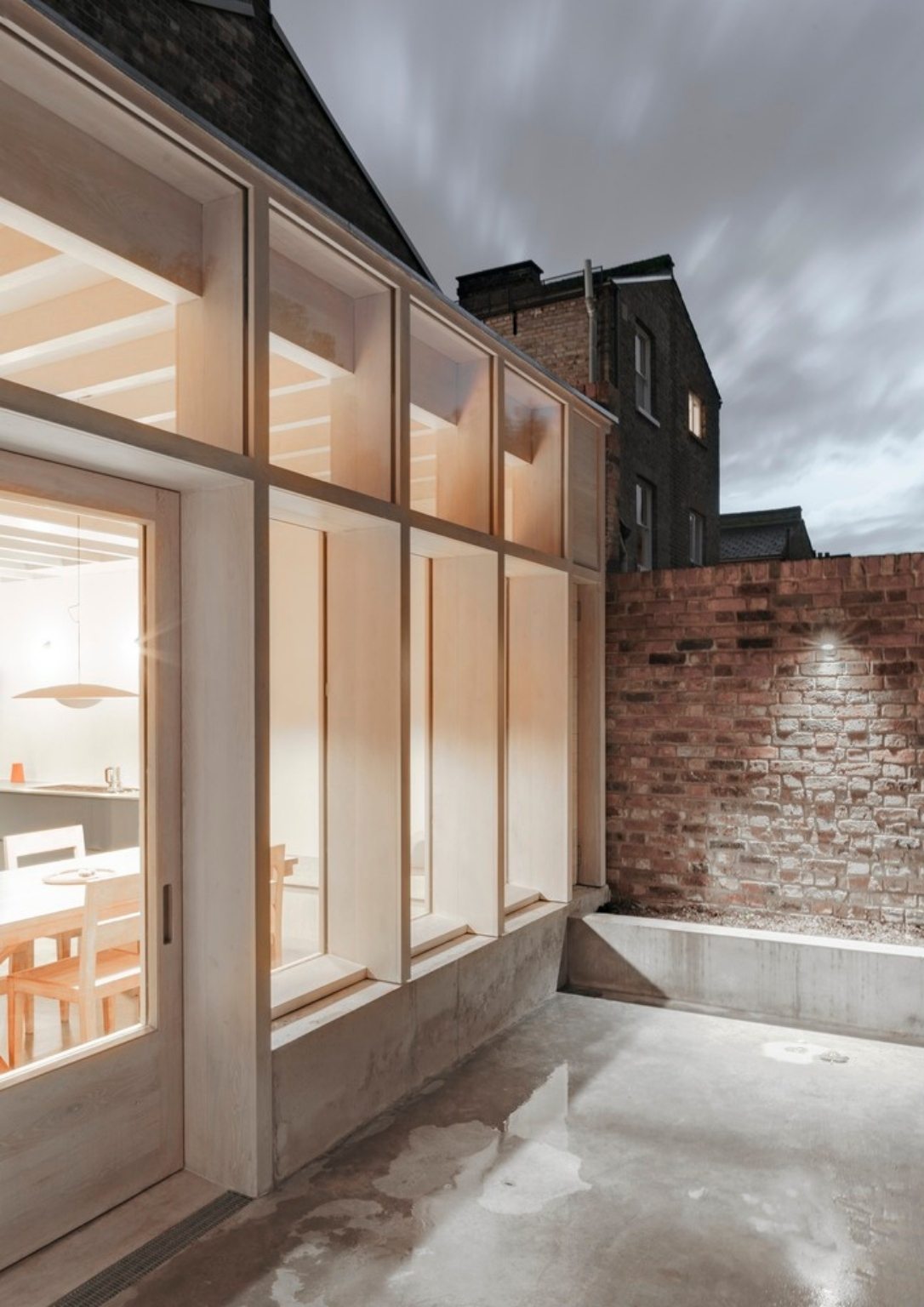 detail of home extension's light wooden exterior