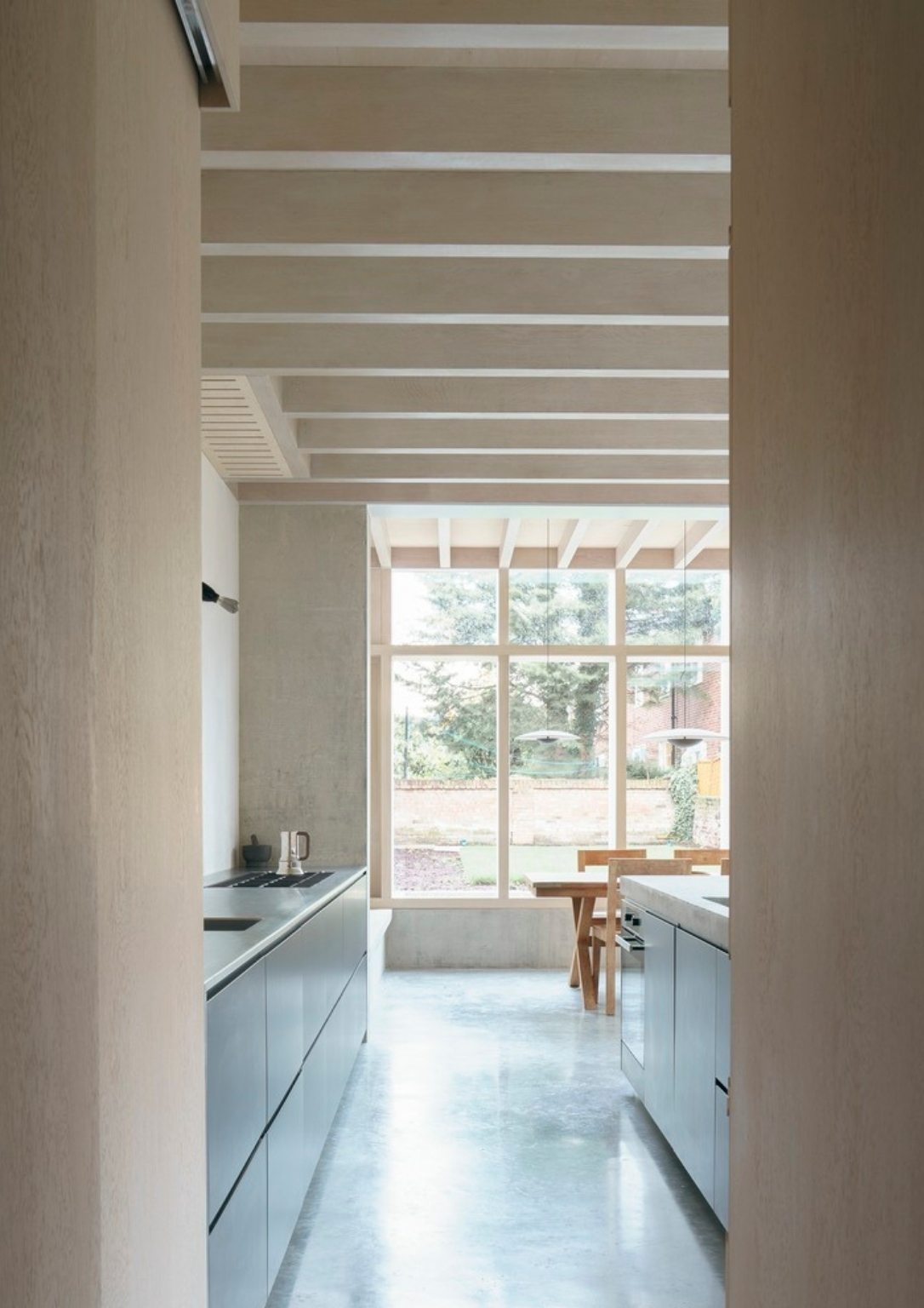 view of modern kitchen looking out into the backyard