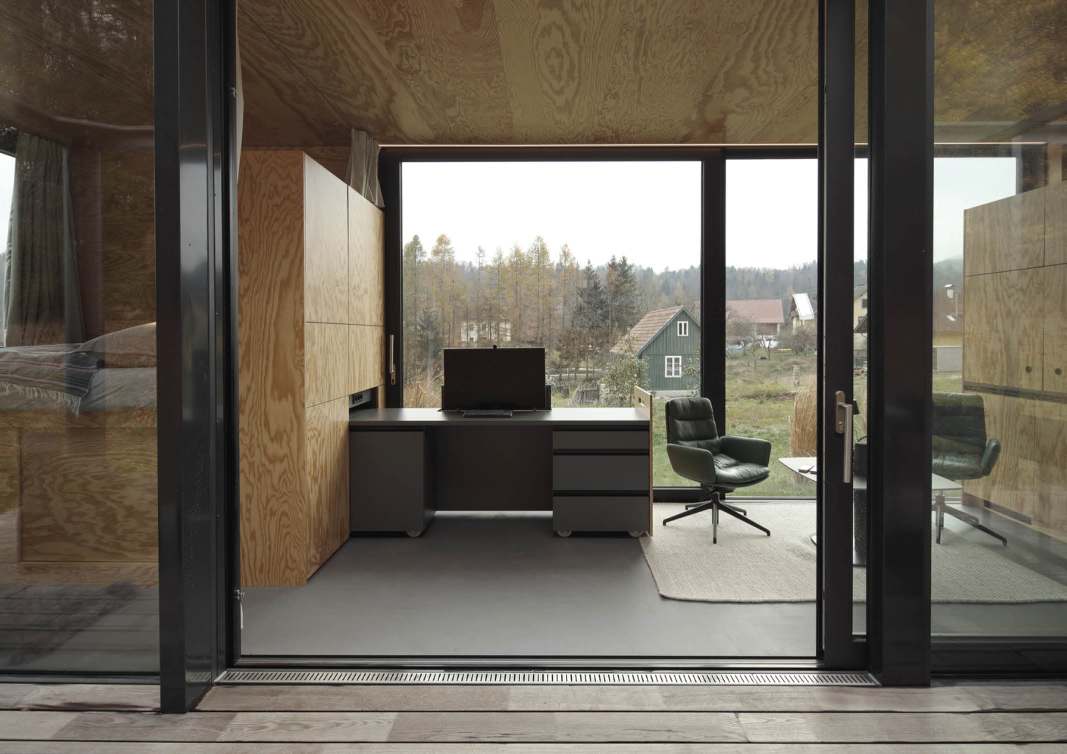 Floor-to-Ceiling Bookshelves Flanking a Desk Design.