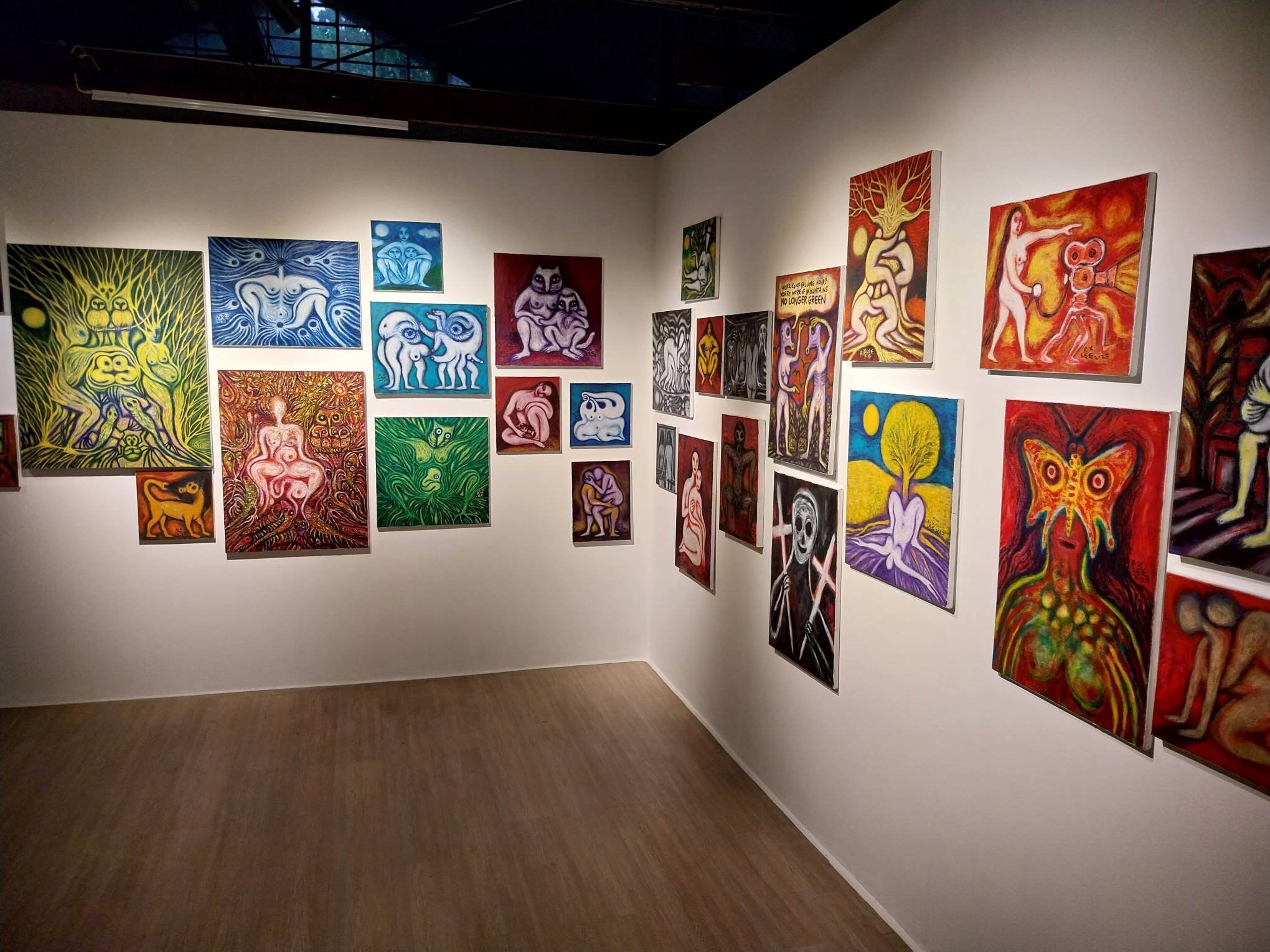Paintings in Roxlee's "Violent Camote" exhibit at Gravity Art Space. Photo by Elle Yap.
