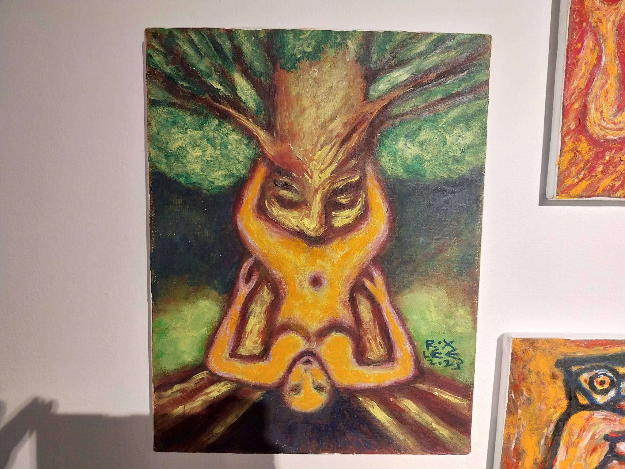 A painting of a woman and a tree in the middle of coitus. Photo by Elle Yap.