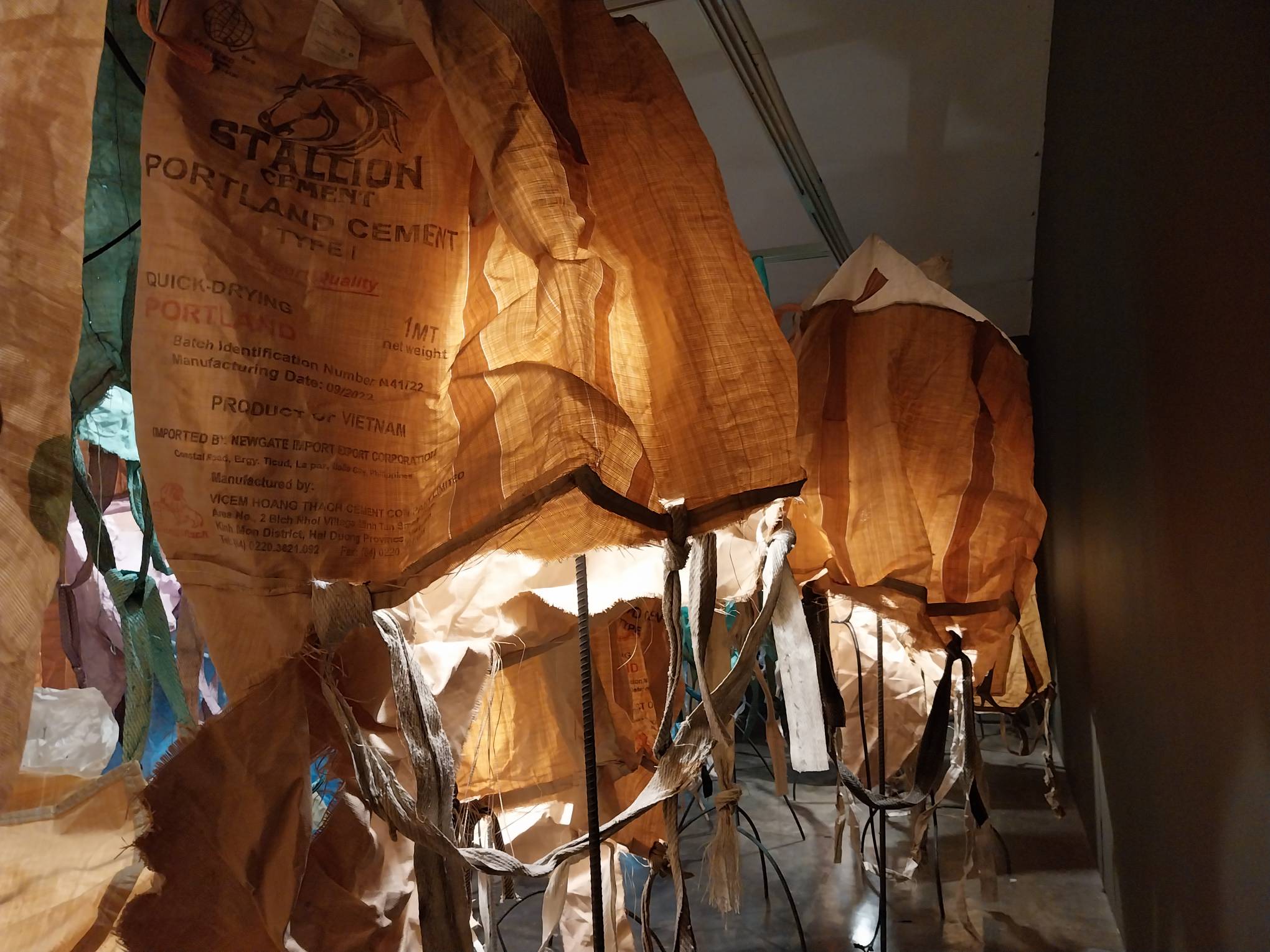 A row of cement bags from the exhibit. Photo by Elle Yap.