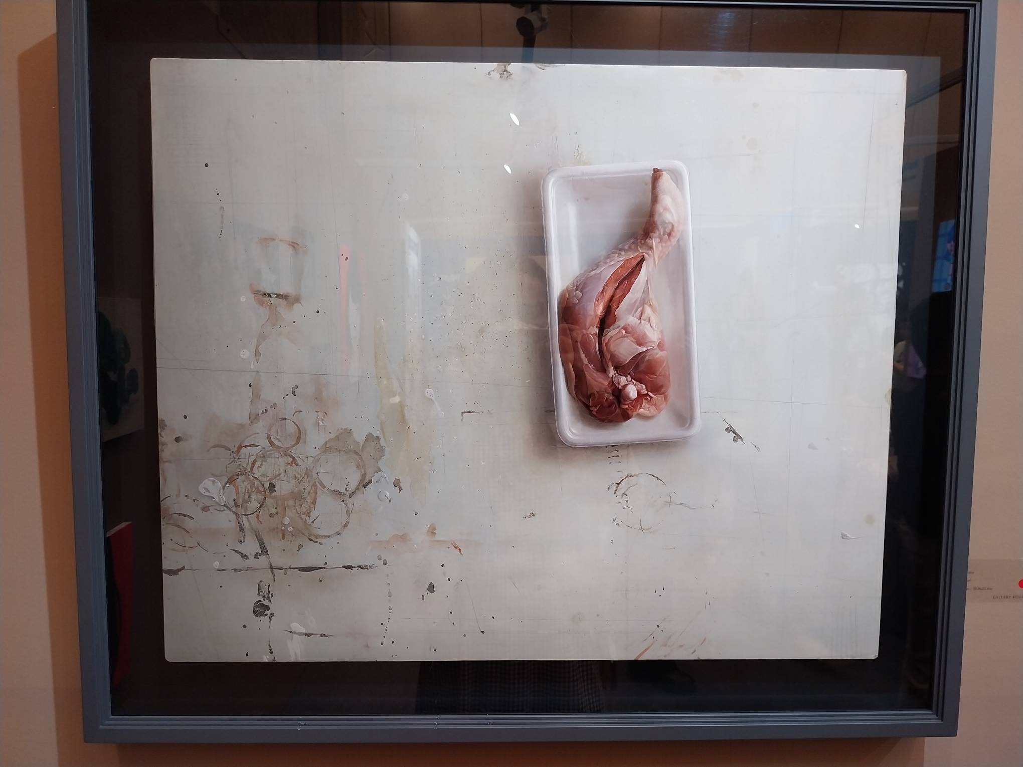 Painting of an uncooked chicken leg. Photo by Elle Yap.