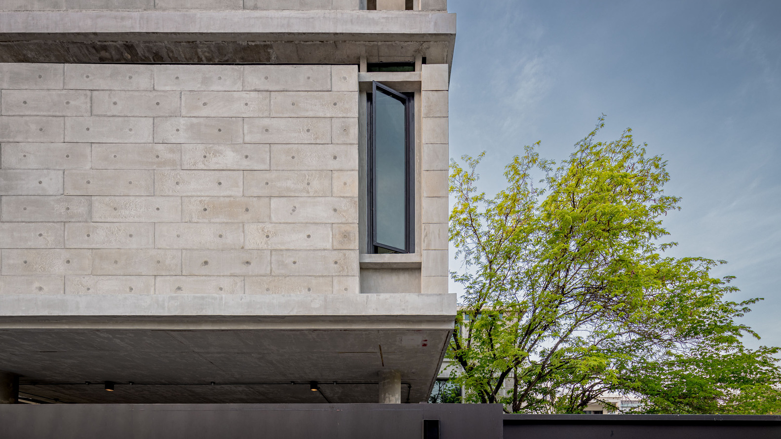 Close-up look at the concrete block walls of the building. Photo by Witsawarut Kekinna.