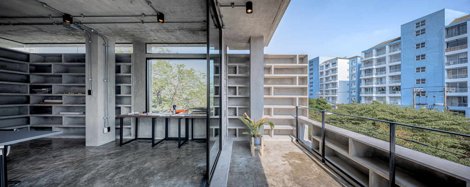 The shelving expanding into the balcony area. Photo by Witsawarut Kekinna.