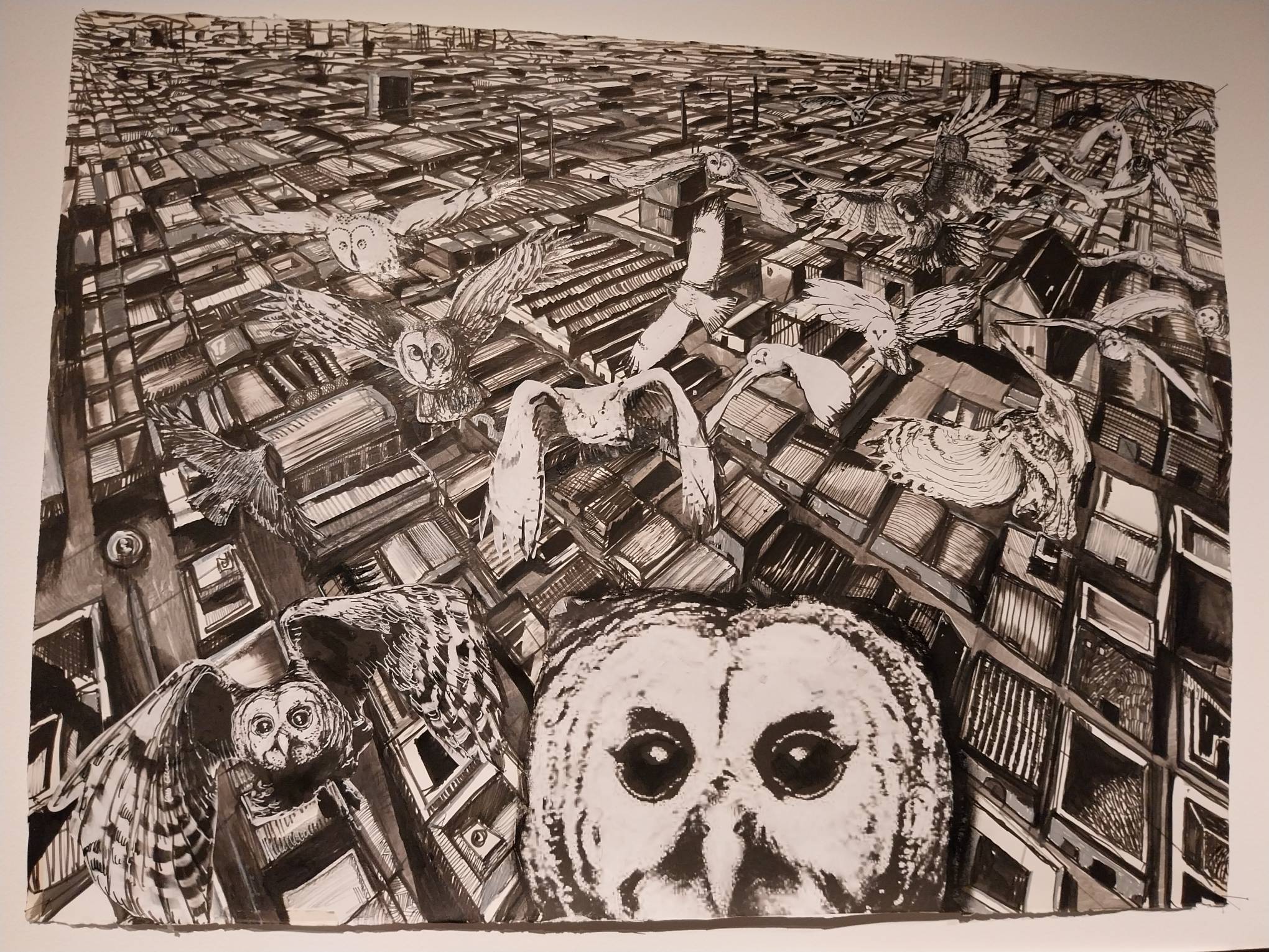 A painting of a city with owls. Photo by Patricia Yap.