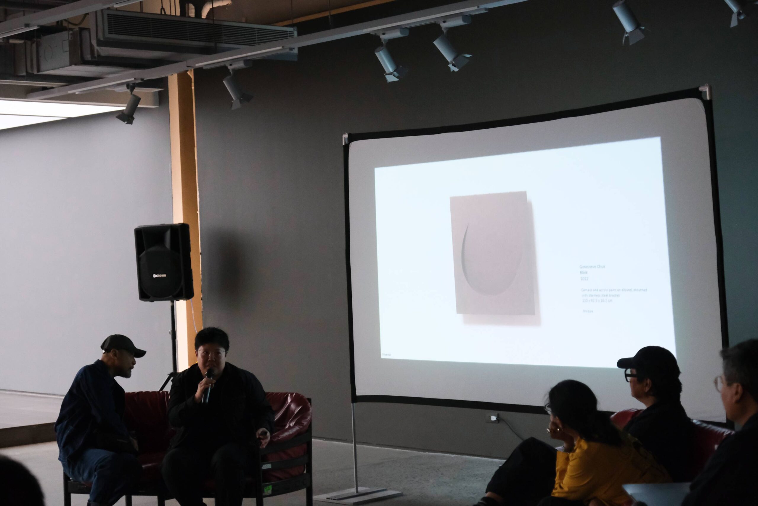 Genevieve Chua discussing her printmaking and paper work. Photo by Ed Simon.