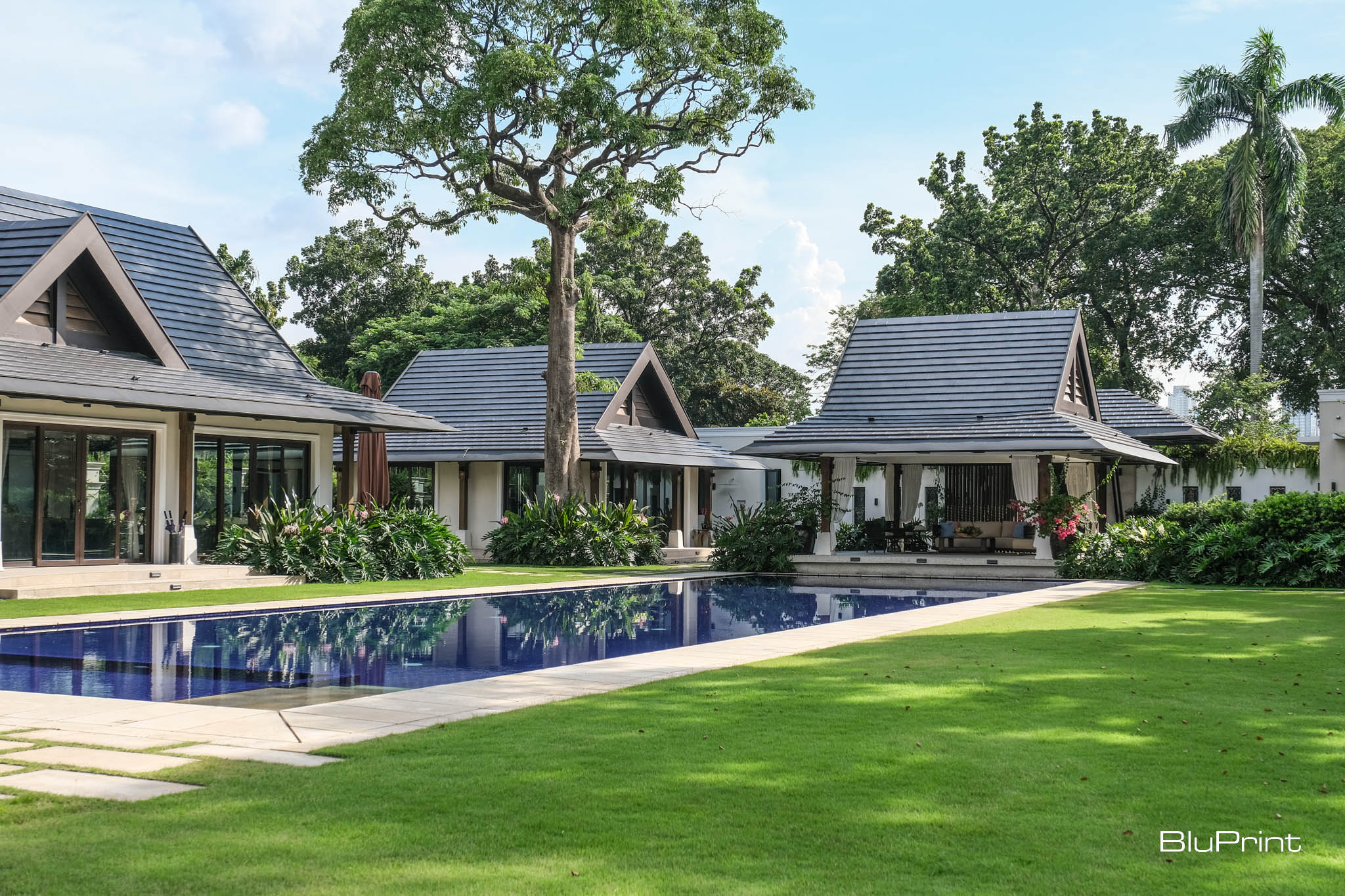 Exterior shots of the pool area, cabana, gym, and pavilion.