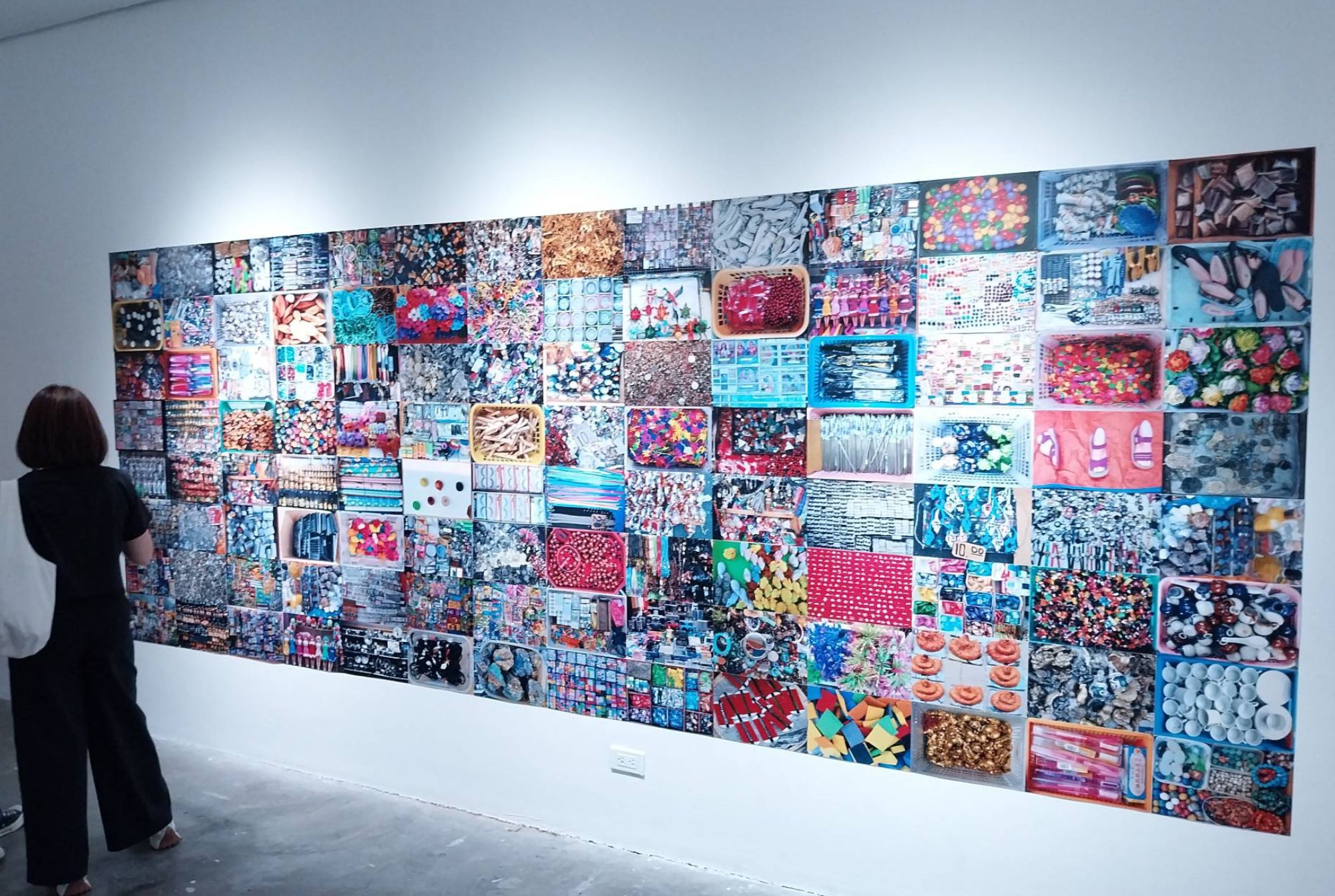 A gallery watcher looking at MM Yu's 