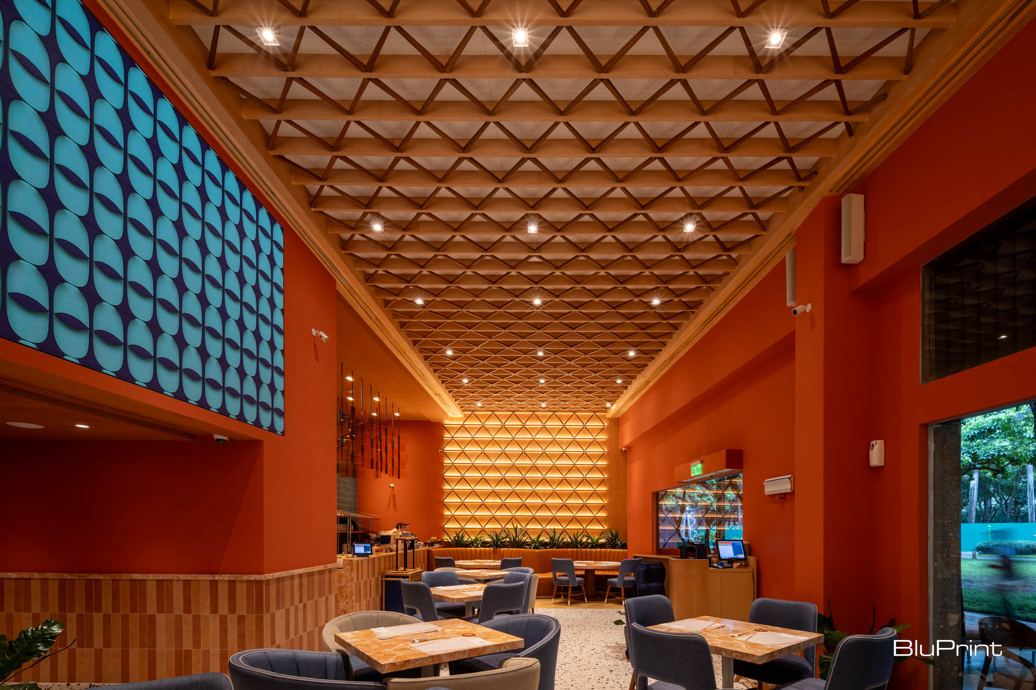 Kazu Cafe's interiors enhanced by chopsticks wall decor and LED art wall.