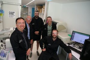 The CCDM, DPIRD and AGT team, (right to left) CCDM Research Assistant Leon Lenzo, DPIRD Research Officer Jason Bradley, AGT Wheat Grower Dion Bennett, DPIRD’s plant pathologist Geoff Thomas, CCDM Associate Professor Kar-Chun Tan, next to a digital PCR machine in the lab.