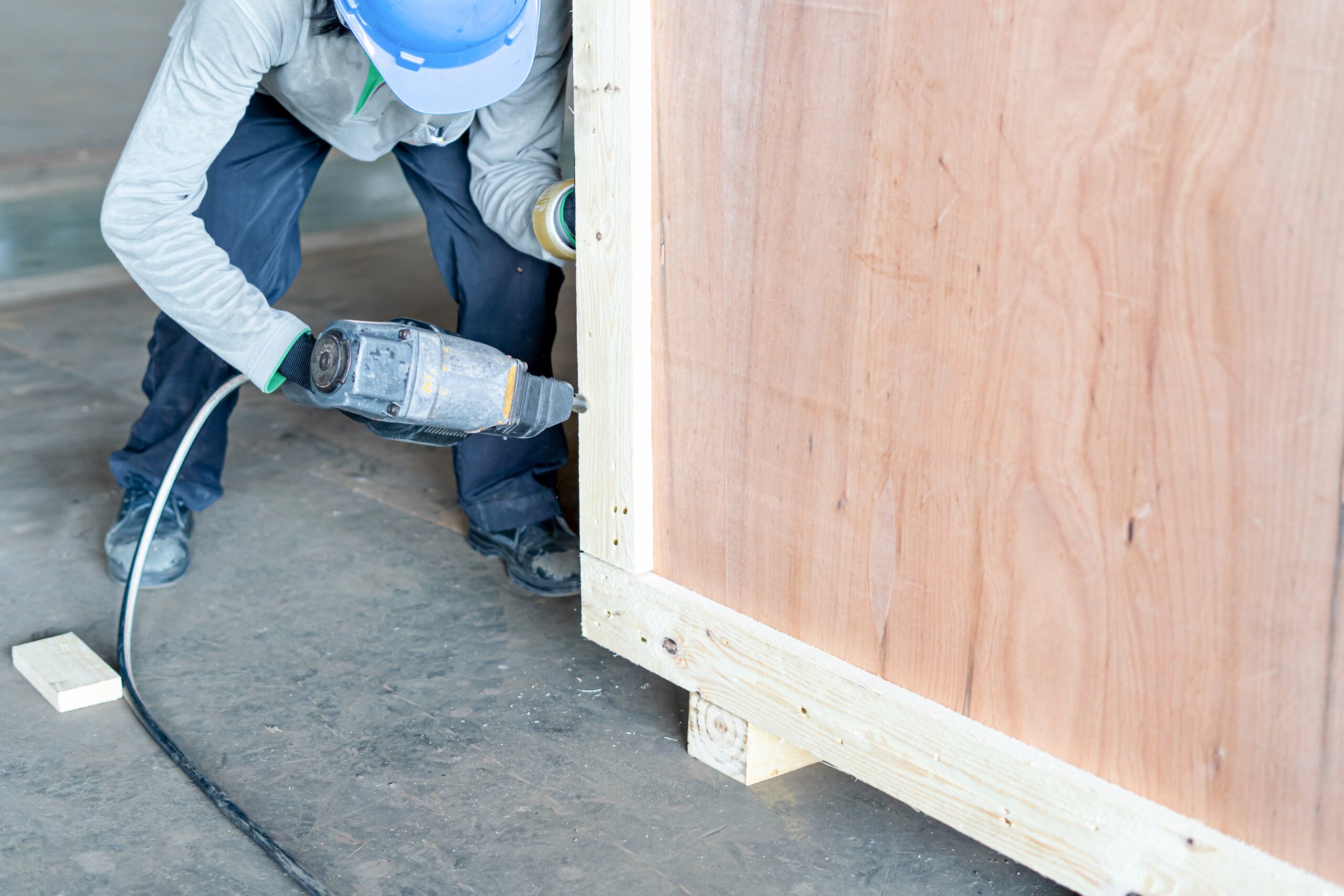 Closeup,Of,A,Man,Using,A,Pneumatic,Nail,Gun,To