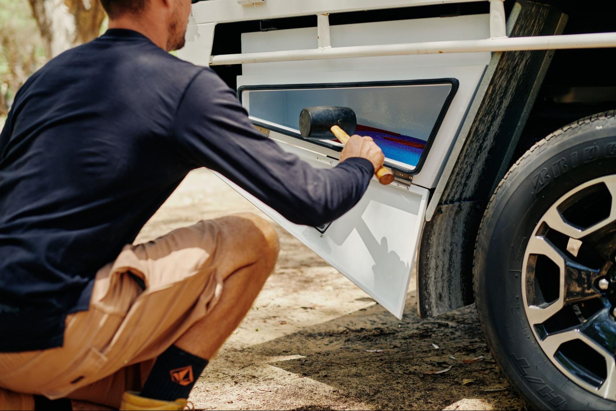 Under tray toolbox next to wheel