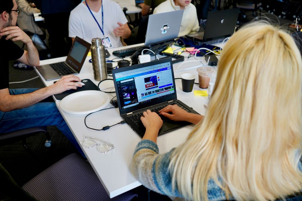 Person looking and working on a laptop