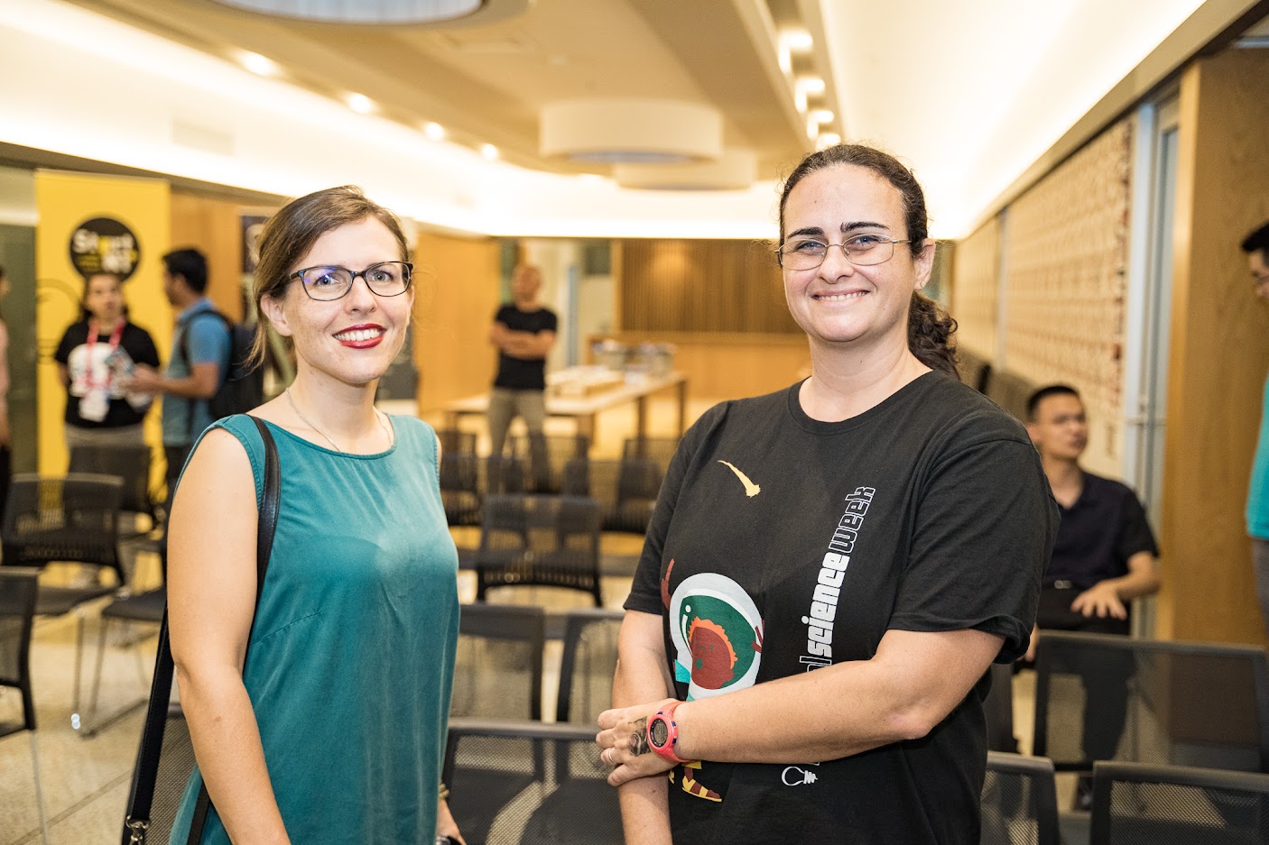 Two people smiling at the camera