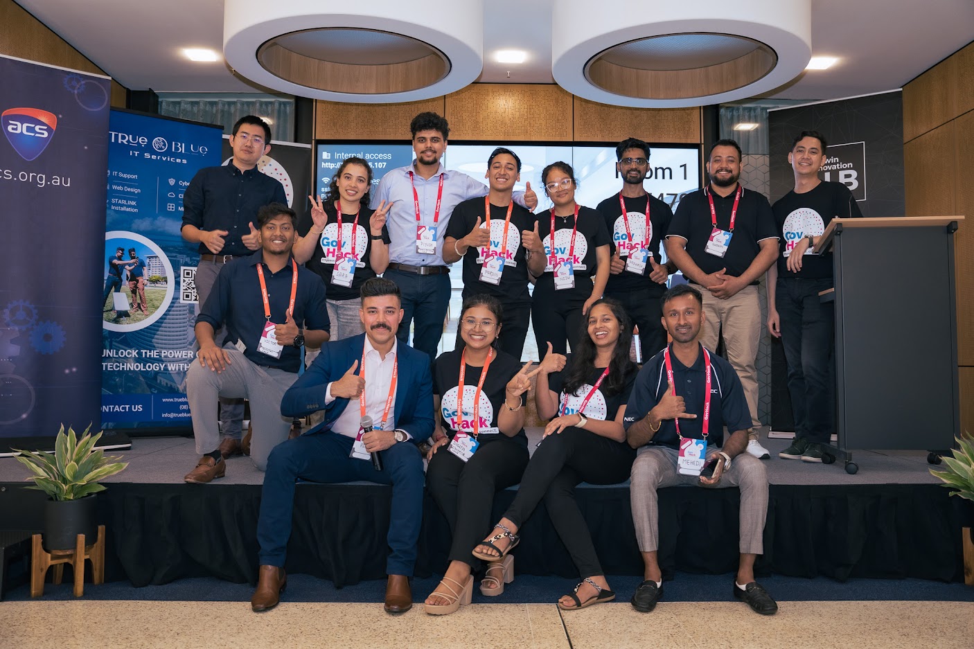 GovHack Volunteers posing on a stage in Darwin