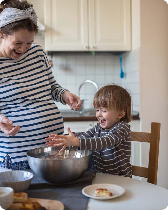 Family enjoying time together in new kitchen after home relocation