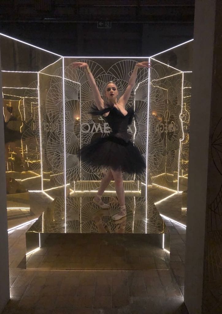 A ballerina danced in celestial brightness and a few meters away, a woman was perpetually winding clocks.