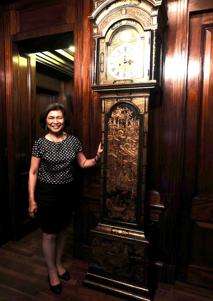 Loida Nicolas Lewis with her English longcase clock, circa 1700s
