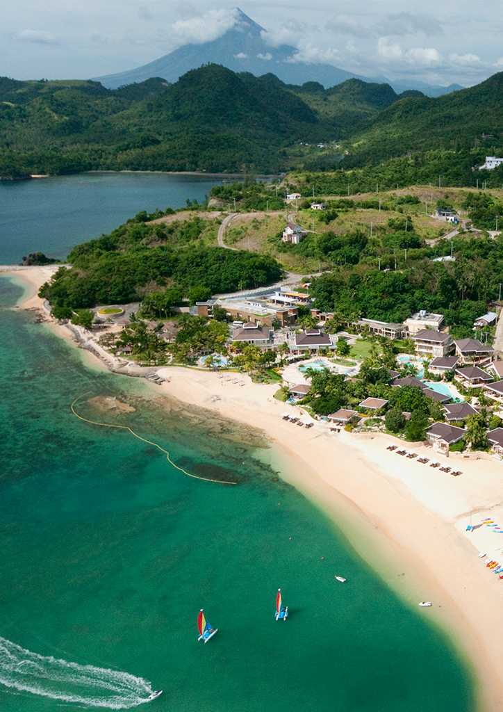 On a clear day, the perfect cone shape of Mount Mayon can be seen from the resort