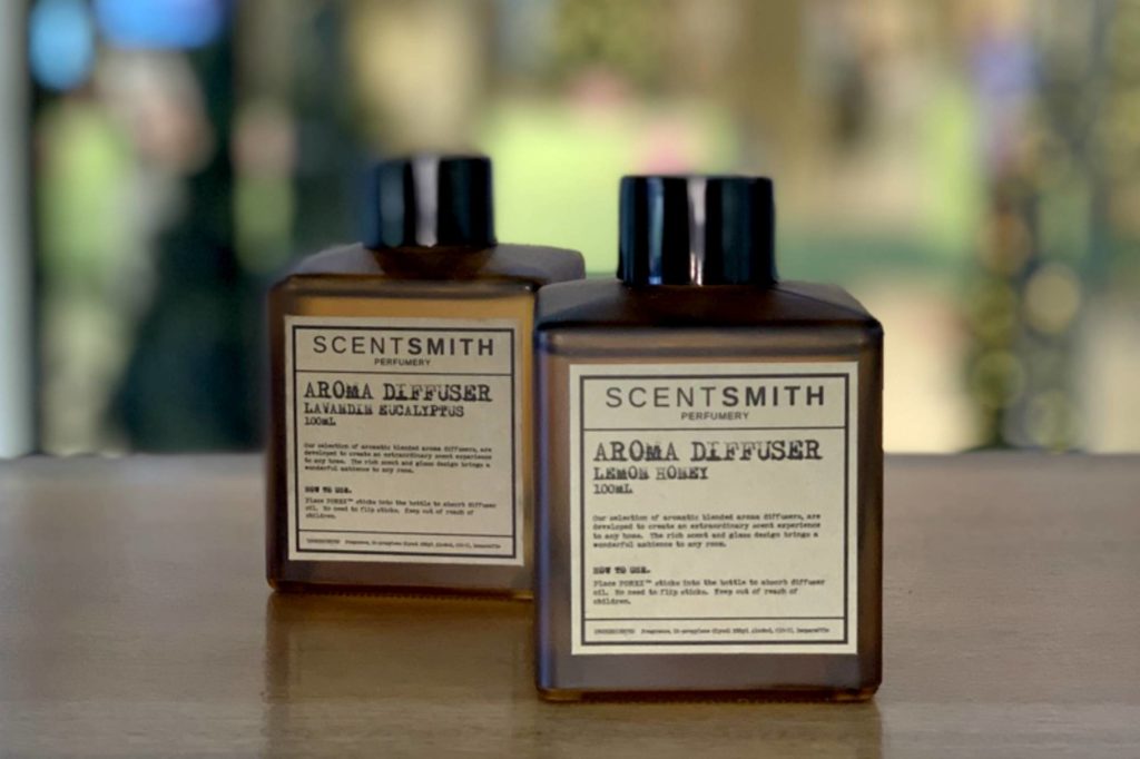 2 Scentsmith Perfumery aroma diffuser bottles on a table