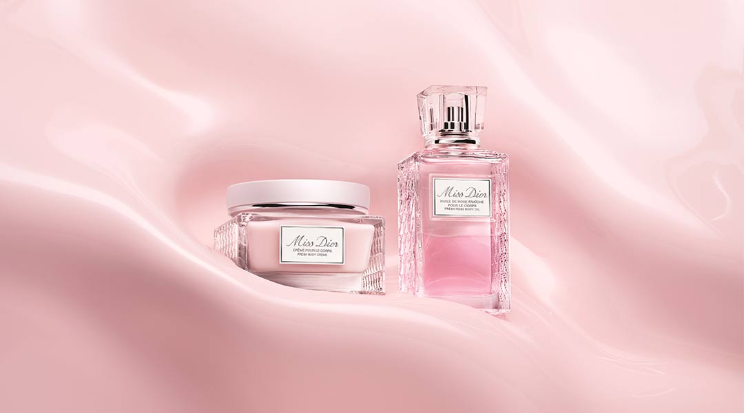 Miss Dior Body Creme and Body Oil on pink satin