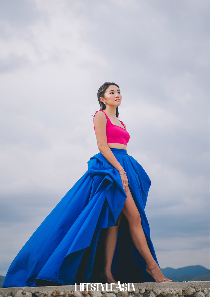 Walking barefoot and leisurely after a day of posing in front of the camera.