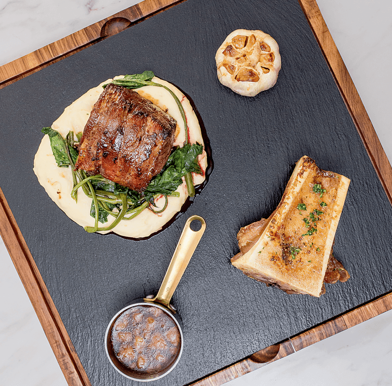 Sky Deck at Novotel Suites Filet Mignon grain-fed beef tenderloin wrapped in bacon, bone marrow, pomme puree