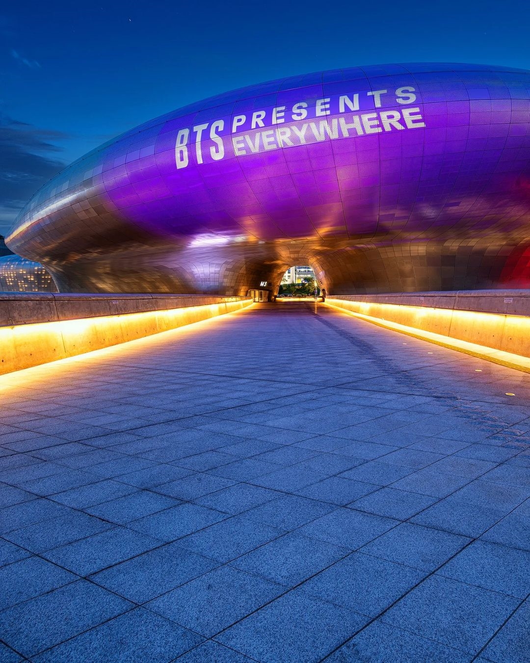 DDP building lit up in purple