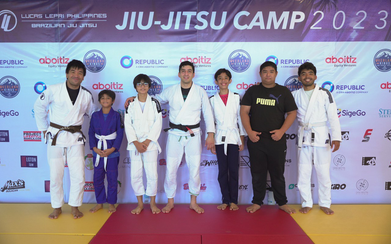 Brazilian Jiu Jitsu Mano Amiga students with Coach Philip Alegre, Professor Lucas Lepri, and Coach Pat Alegre