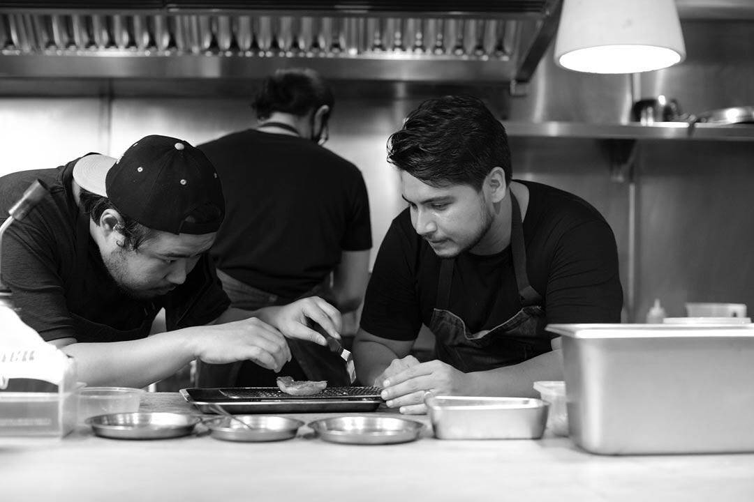 Chef Stephan Duhesme (R) at work