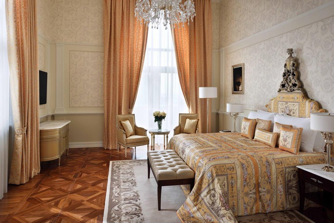 A grand bedroom inside the Signature Suites at Palazzo Versace Dubai