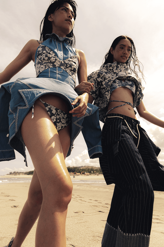 On Anna (L): Denim halter top with inverted jacket peplum, floral bralette and bikini bottoms; On Yaofa (R): Floral print denim Cuban shirt, cloud print bralette, pinstriped denim pants with attached Cuban shirt peplum, all by JAGGY GLARINO