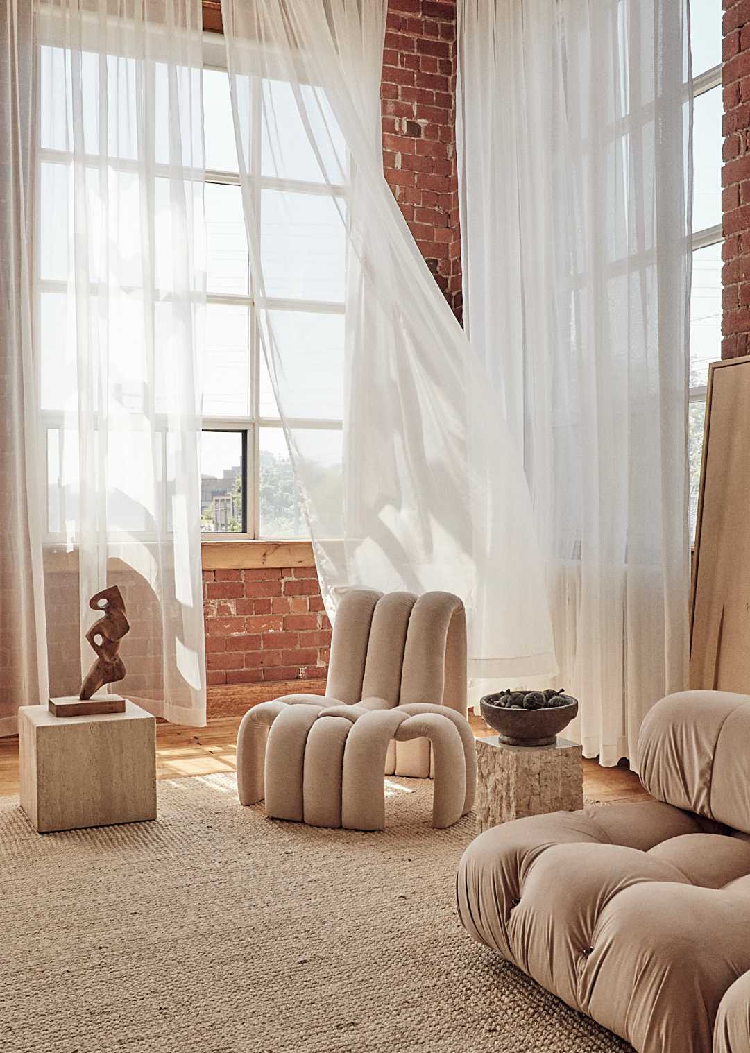 With its ample light, double-height ceilings and open layout, Bona realized the potential of his Toronto apartment as both a home and creative studio.