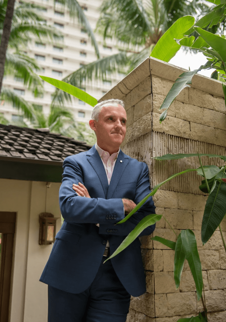 Jonathan Reynolds standing near the poolside of EDSA Shangri-La