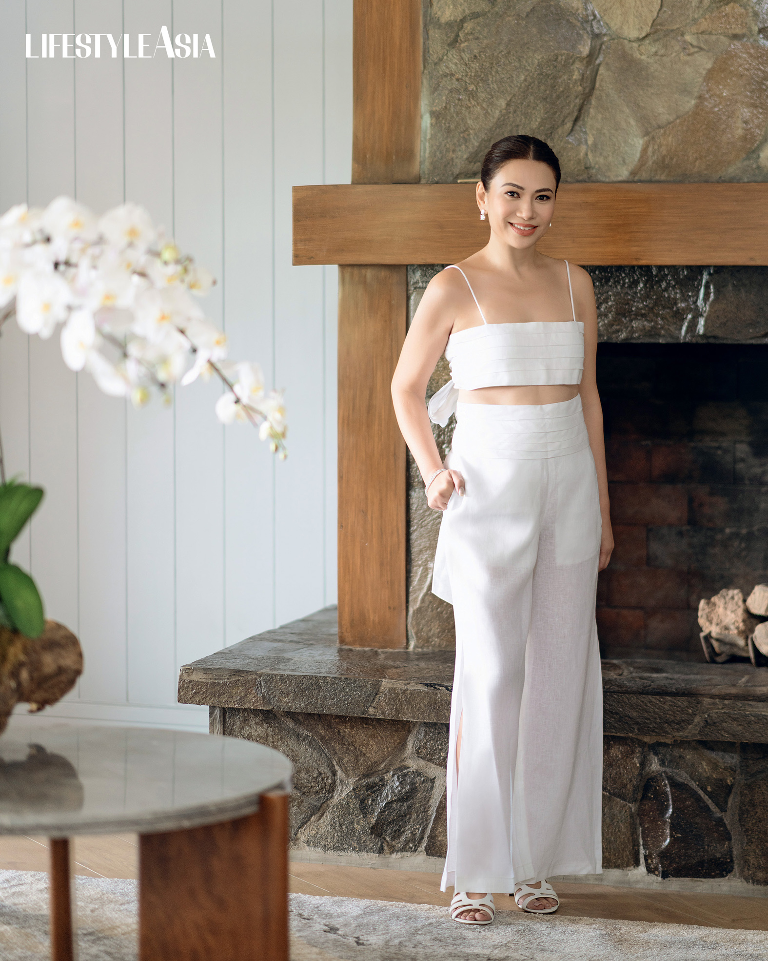 White linen bandeau top and matching pants, TRUDE LIZARES; Diamond dangling earrings, JMA JEWELRY.