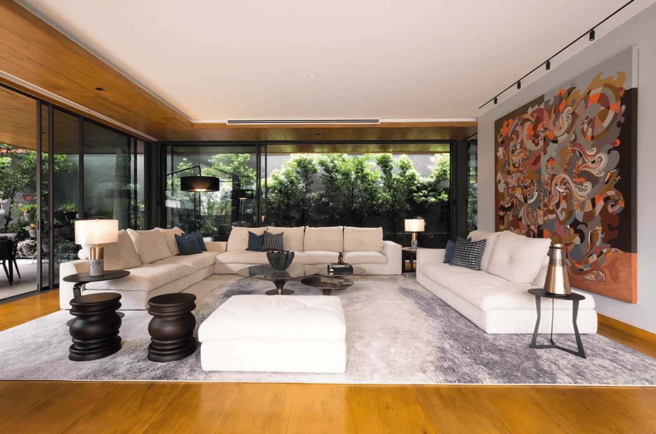 Pineda, who also designed the interiors, chose low-slung sofas from Roche Bobois for one of two living areas, with the disciplined color story of pale hues and earthy tones adding to the casual vibe.