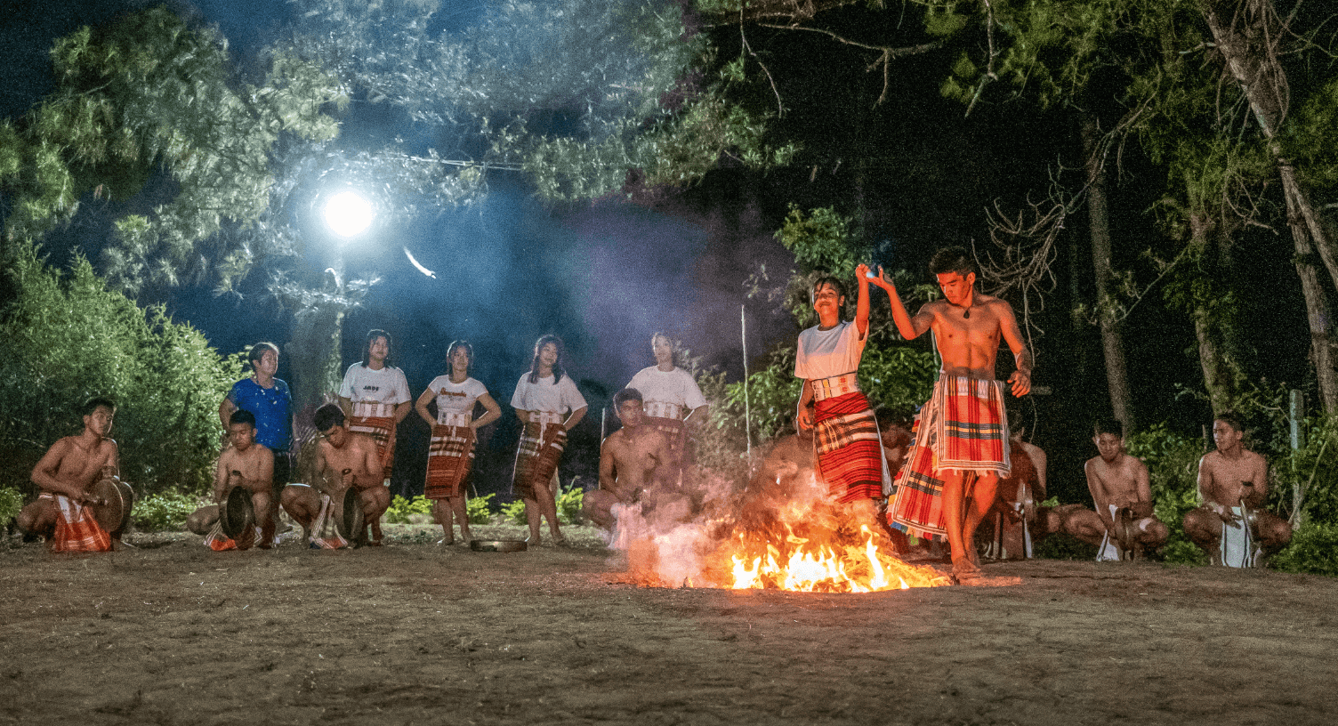 Traditional dancers wearing "tapis" and "bahag"