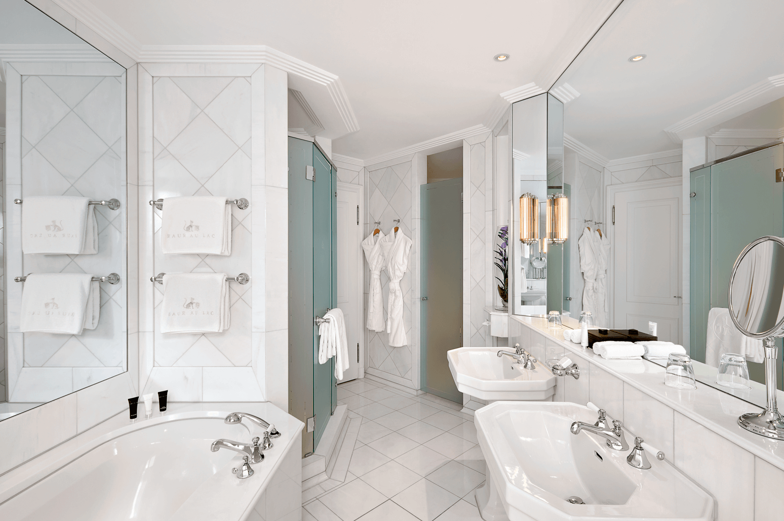 The hotel boasts beautifully appointed rooms and suites, each exuding sophistication and offering breathtaking views of either the lake or the lush private garden.